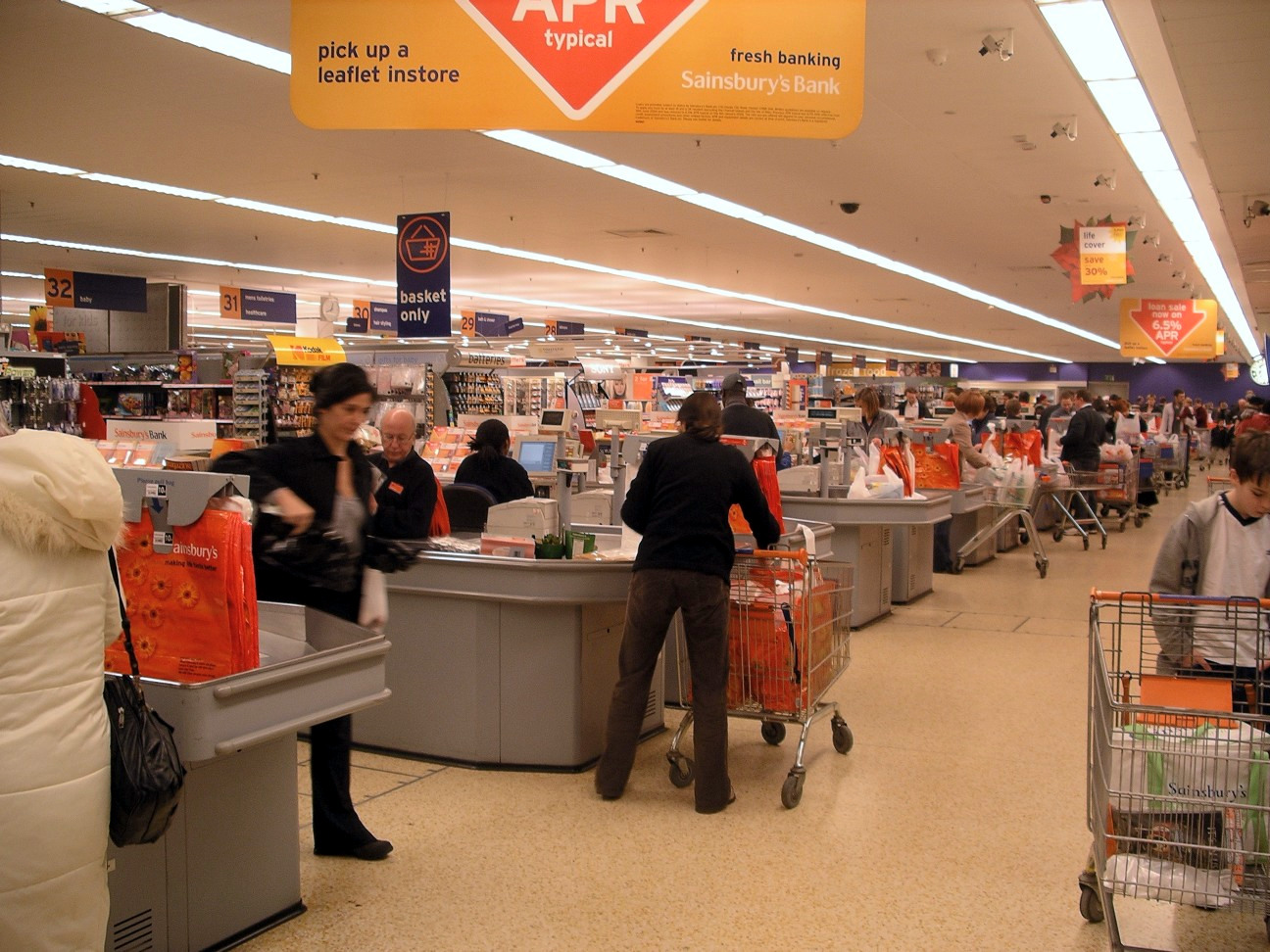 Busy supermarket checkout area